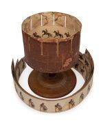ZOETROPE rare antique pre-film animation device on original oak stand with a handsome selection of seventeen double sided lithograph animation strips, 19th century. Note: In working order. 38cm high, 30cm diameter.