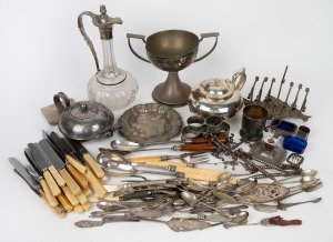 Assorted antique and vintage silver plated ware including a claret jug, napkin rings, cutlery, serving utensils, chamberstick candle holder, condiments etc., 19th/20th century, (qty).