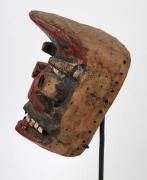 A tribal Dan Gere mask, carved wood with painted finish on bespoke stand, Liberian origin, the mask 26cm high, 46cm high overall. - 3