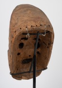 A tribal Dan Gere mask, carved wood with painted finish on bespoke stand, Liberian origin, the mask 26cm high, 46cm high overall. - 4