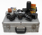 MINOLTA SRT SUPER 35mm camera with assorted lenses and accessories, housed in a cargo style case, the case 46cm wide.