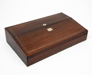 An antique English rosewood lap desk of elegant slimline proportions, mid19th century, 9cm high, 40cm wide, 24cm deep.
