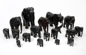 Group of seventeen assorted Ceylonese carved ebony elephant ornaments with bone tusks and toes, A/F, 20th century, ​​​​​​​the largest 20cm high.
