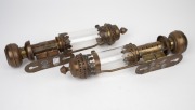 A pair of railway wall mounted candle lanterns with spring loading mechanism, brass, copper and glass, 19th/20th century, with applied copper label "G.W.R.", 35cm high. - 2