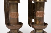 A pair of railway wall mounted candle lanterns with spring loading mechanism, brass, copper and glass, 19th/20th century, with applied copper label "G.W.R.", 35cm high. - 3