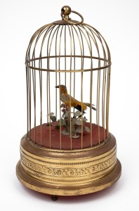A vintage Continental clockwork singing bird in cage automata, 20th century, 30cm high overall.