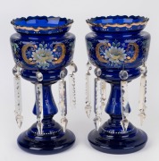 A pair of antique Bristol blue glass mantle lustres with hand-painted floral enamel decoration, 19th century, 36cm high.