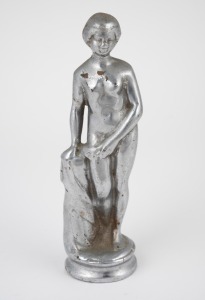 A vintage car hood ornament mascot of a standing female nude with drapery, circa 1920s, 14cm high.