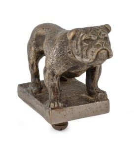 Vintage bulldog bonnet ornament mascot, cast brass with remains of nickel plated finish, retaining original bolt, circa 1920s, 7cm high, 10cm long.