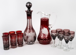 Thirteen pieces of assorted ruby and cranberry glass, comprising of jugs, pickle jars, bottles etc., 19th and 20th century, the largest 21cm high.