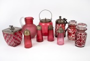 Antique ruby glass sugar castors, pickle jars, biscuit barrels, jug and tankard, 19th century, (10 items), the tallest 19cm high.