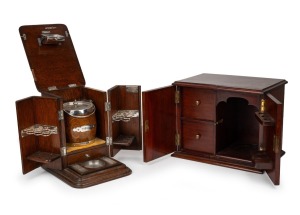 Two antique English mahogany and oak humidors, one beautifully fitted with silver plated accessories and tobacco jar (sadly damaged), 19th century, (2 items), 26cm and 25cm high.