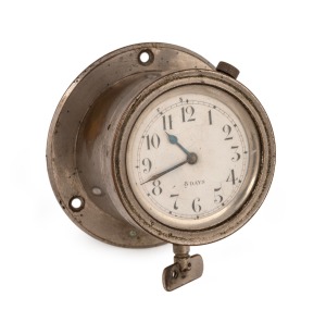 A vintage automotive dash mount clock in nickel case with eight day movement, circa 1920, 10.5cm diameter.