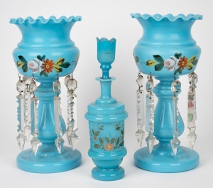 A pair of blue glass mantle lustres with floral hand-painted finish; together with a decanter in the same colour, 19th century, (3 items), 29cm and 26cm high.