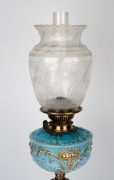 A banquet lamp, blue glass font with gilt and floral enamel highlights, black button double burner with acid etched shade and Corinthian column base, 19th century and later, 79cm high. - 2
