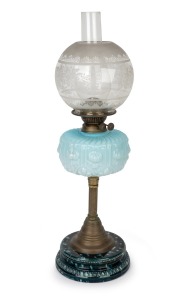 An antique oil lamp with blue glass font, double burner, acid etched shade and chimney on brass and mottled ceramic base, 19th century, ​​​​​​​​​​​​​​64cm high.