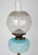 An antique oil lamp with blue glass font, double burner, acid etched shade and chimney on brass and mottled ceramic base, 19th century, ​​​​​​​​​​​​​​64cm high. - 2