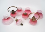 Assorted pink glass piano light fonts and shades with burners, 19th/20th century, (qty).