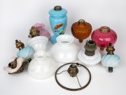 ANTIQUE OIL LAMP PARTS including blue piano light fonts and burners, pink piano light shade, assorted milk glass oil lamps and burners, 19th century, (qty), the largest 25cm high.