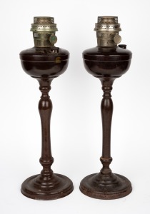 A pair of vintage bakelite oil lamps with Aladdin burners, early to mid 20th century, 55cm high.