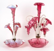 Two antique English vaseline and ruby glass epergne centrepieces, 19th century, ​​​​​​A/F, 53cm and 56cm high.