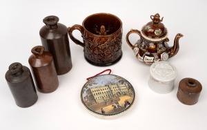BARGE WARE antique English miniature pottery teapot, Pratt ware pot lid of Buckingham Palace, a German pharmaceutical pottery pot and lid, a Rockingham glazed antique English frog mug and assorted stoneware mercury and acid bottles, 19th and 20th century, (8 items), the teapot 14cm high.