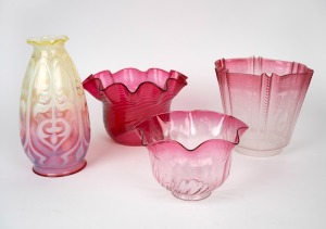Four assorted antique and vintage ruby and vaseline glass light shades, 19th/20th century, the largest 24.5cm high.