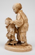 A Japanese carved ivory okimono figural group of a man and child, Meiji Period, 19th/20th century, with red seal mark to base, 10cm high. - 3