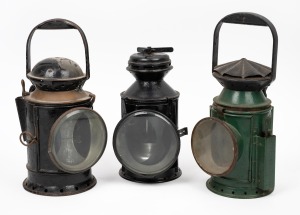 Three antique signal lanterns in black and green painted finish, 19th/20th century, ​​​​​​​the largest 32cm high overall.