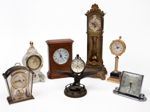Seven assorted vintage clocks, including miniature longcase, porcelain and nickel cased examples, 20th century, the largest 33cm high.