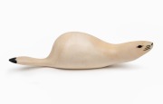A Norwegian Sami marine ivory carving of an otto, 20th century, ​​​​​​​13.5cm long.