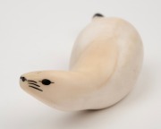 A Norwegian Sami marine ivory carving of an otto, 20th century, ​​​​​​​13.5cm long. - 2