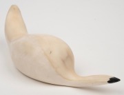 A Norwegian Sami marine ivory carving of an otto, 20th century, ​​​​​​​13.5cm long. - 3