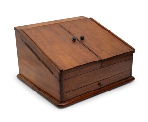 An Australian blackwood desk tidy with slope front, 20th century, ​​​​​​​26cm high, 43cm wide, 40cm deep.