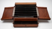 An Australian blackwood desk tidy with slope front, 20th century, ​​​​​​​26cm high, 43cm wide, 40cm deep. - 2