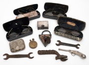 Antique spectacles, can opener, spanners, stud box, coin holder, bosun whistle, cigarette lighter and padlock, 19th and 20th century, (12 items).