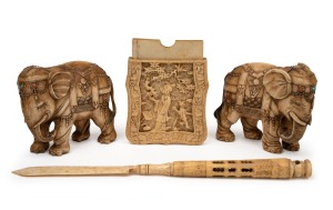 A pair of Chinese carved ivory elephant ornaments, inlaid with turquoise and coral; together with an antique Chinese carved ivory card case (base only) and a carved whalebone letter opener Stanhope with internal nib, 19th and 20th century, (4 items), A/F, the elephant 22cm long.