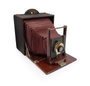 ROCHESTER OPTICAL CO.: "Pony Premo No. 3" folding camera, c. 1898, plate dimensions approx. 18 x 14cm, vivid red bellows, Wollensak pneumatic shutter.