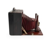 ROCHESTER OPTICAL CO.: "Pony Premo No. 3" folding camera, c. 1898, plate dimensions approx. 18 x 14cm, vivid red bellows, Wollensak pneumatic shutter. - 3