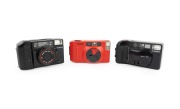 CANON: Group of 1980s plastic point-and-shoot cameras, comprising Sure Shot Supreme, Sure Shot, and Snappy S. (3 items)
