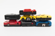 PLASTIC POINT-AND-SHOOT CAMERAS: Diverse 1980s-90s group comprising Hanimex Date, Hanimex 35D, Kafon KA-501, Longbeach PC-606, "Showbag Carousel", Yashica Electro 35 AF-Mini, and Yashica Partner AF (red). (7 items) - 3