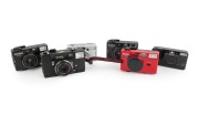 KONICA: Group of 1990s plastic point-and-shoot cameras, comprising A4 Close Up/Auto Focus, C35 AF, C35 EF3, Pop (black x 2), and Z-Up 60e AF. (6 items)