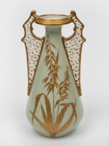 An antique English porcelain vase, beautifully decorated with pierced porcelain handles and hand-painted floral decoration on sage green ground, 19th century, 20cm high.