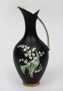 K.P.M. vintage German black porcelain jug with lily of the valley decoration and gilt highlights, mid 20th century, factory mark to base, 23cm high.