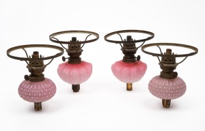 Two pairs of antique pink glass piano oil lamps, 19th/20th century, 18cm high, 14cm diameter.