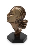 An Art Deco profile portrait female head ornament mounted on black slate base, circa 1930s, 19cm high.