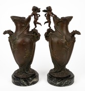 A pair of antique French spelter mantle urns with angels and floral decoration in the Art Nouveau style, on green marble bases, 19th/20th century, 43cm high. - 2