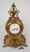 A three piece French gilt bronze clock garniture in the Rococo style, with eight day time and gong strike movement, 19th century, 47cm and 49cm high. - 2
