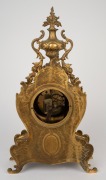 A three piece French gilt bronze clock garniture in the Rococo style, with eight day time and gong strike movement, 19th century, 47cm and 49cm high. - 3