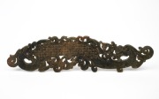 A Chinese carved jade scroll rest in the archaic style, 20th century, 30cm high.